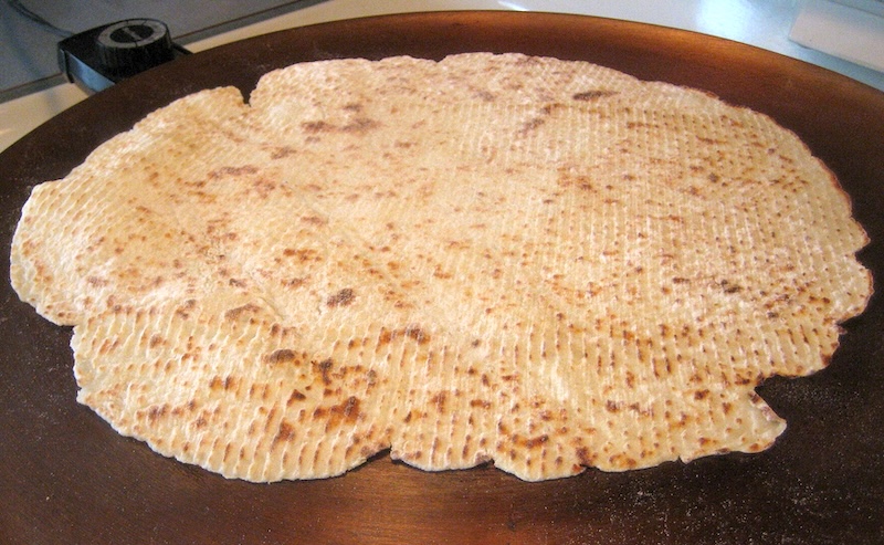 A lefse on a griddle, cooking